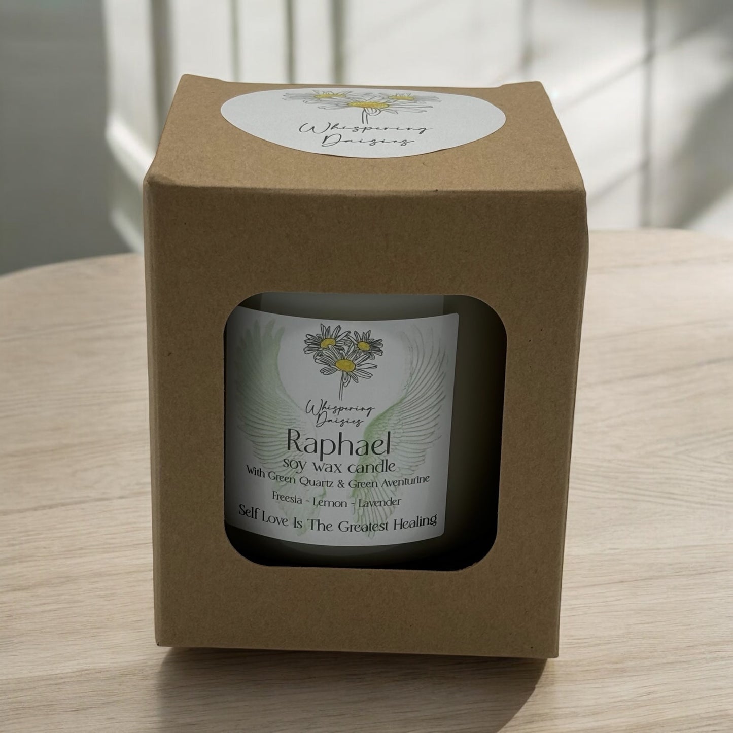 Raphael Angel Candle in a clear glass jar, topped with green quartz and green aventurine crystals, handmade soy candle from Whispering Daisies in North Devon.