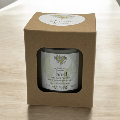 Haniel Angel Candle in a clear glass jar, topped with silver lead jasper and citrine crystals, handmade soy candle from Whispering Daisies in North Devon.