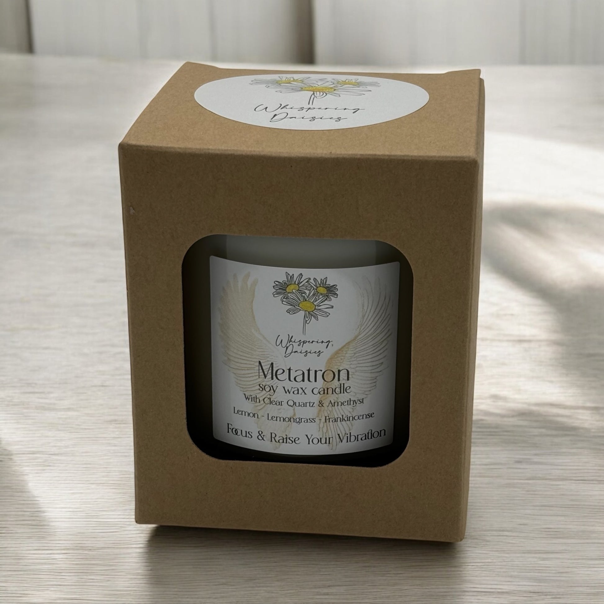 Metatron Angel Candle in a clear glass jar, topped with clear quartz and amethyst crystals, handmade soy candle from Whispering Daisies in North Devon.