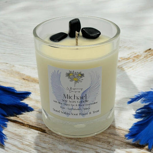 Michael Angel Candle in a clear glass jar, topped with blue tiger’s eye and black tourmaline crystals, handmade soy candle from Whispering Daisies in North Devon.