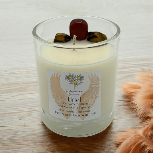 Uriel Angel Candle in a clear glass jar, topped with carnelian and tiger’s eye crystals, handmade soy candle from Whispering Daisies in North Devon.